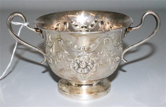 Edwardian embossed silver two-handled cup